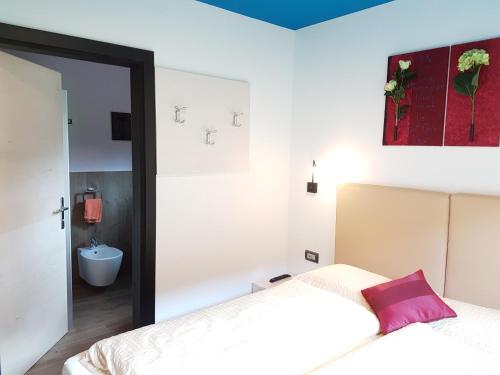 a bedroom with two beds and a mirror at Lucas Haus in Livigno