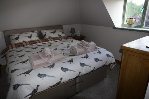מיטה או מיטות בחדר ב-Thonock lane lodge