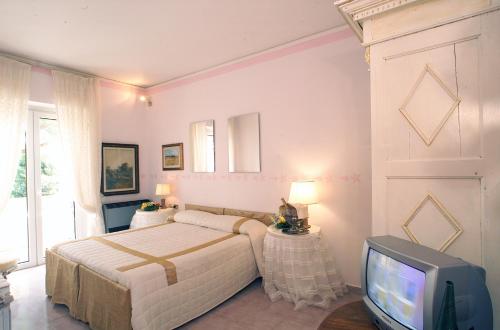 Posteľ alebo postele v izbe v ubytovaní Hotel Velcamare