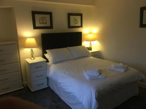 En eller flere senger på et rom på Cosy One Bedroom Apartment - Ellon Town Centre