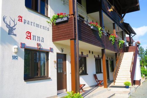 a building with flowers on the side of it at Apartments Anna in Tahkovuori
