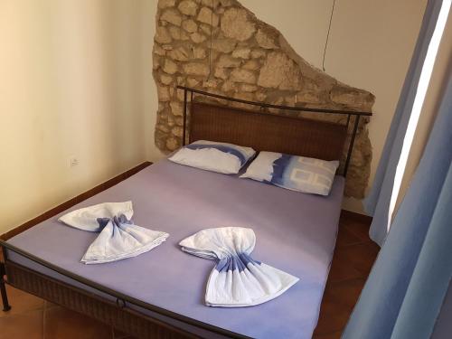 Ένα ή περισσότερα κρεβάτια σε δωμάτιο στο Apartments Mirela