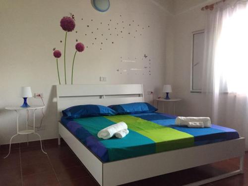 Een bed of bedden in een kamer bij Camere e Casa Vacanze