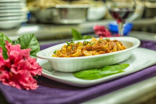 a bowl of food on a plate on a table at Bocawina Rainforest Resort in Hopkins