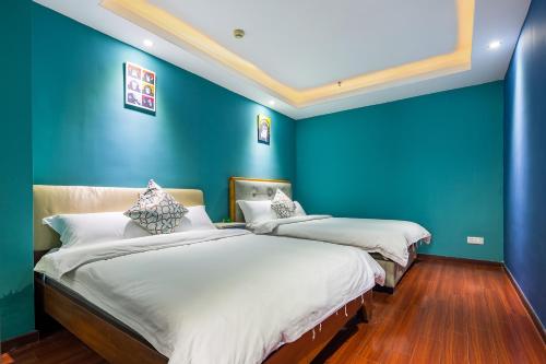 Cama ou camas em um quarto em Guangzhou Xingke Apartment