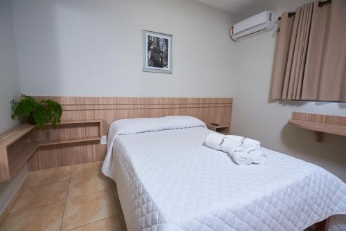 Ein Bett oder Betten in einem Zimmer der Unterkunft Pousada Giramundo