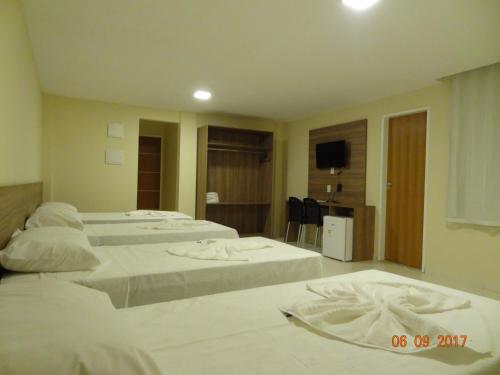 Postel nebo postele na pokoji v ubytování Ilha Bela Hotel