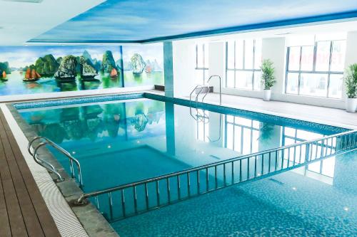 a large swimming pool in a building at Song Loc Luxury Hotel in Ha Long