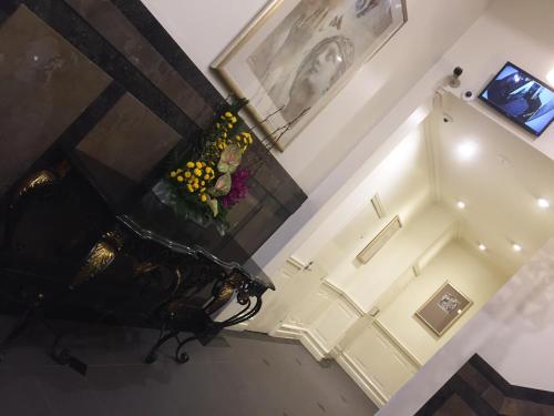 an overhead view of a staircase with a vase of flowers at Flinders Landing Apartments in Melbourne