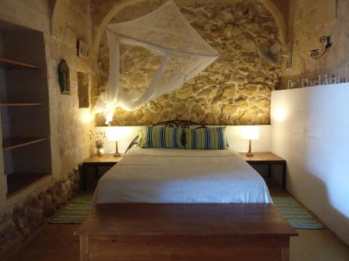 Postel nebo postele na pokoji v ubytování Gozo Holiday Home -Tranquil and Serene