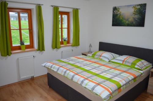 Ein Bett oder Betten in einem Zimmer der Unterkunft Apartmán Pohoda Nová Pec