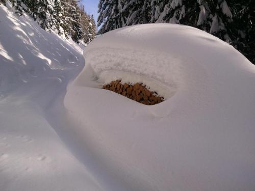 a snow igloo with a pile of food in it at Seepension Knappenhof in Pertisau