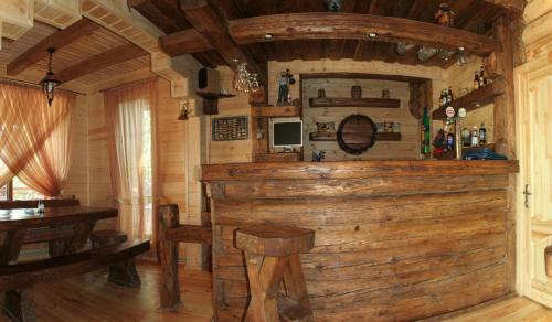 a room with a wooden bar in a cabin at Laguna in Slavske