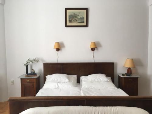 מיטה או מיטות בחדר ב-Igmándy kúria