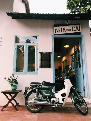 a motorcycle parked in front of a building at Vietnam Phuot Real Home in Kon Tum