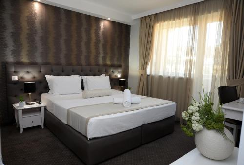 Postel nebo postele na pokoji v ubytování Alexandar Square Apartments
