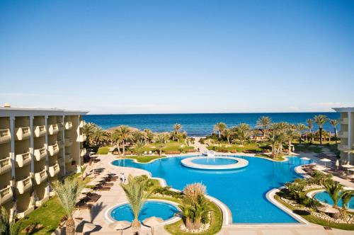 an aerial view of the resort with the ocean in the background at Royal Thalassa Monastir in Monastir