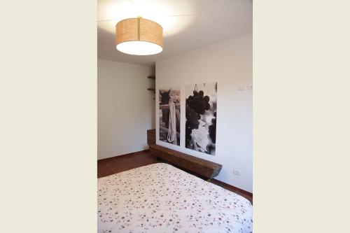 Letto o letti in una camera di Bio Agriturismo Corte degli Ulivi
