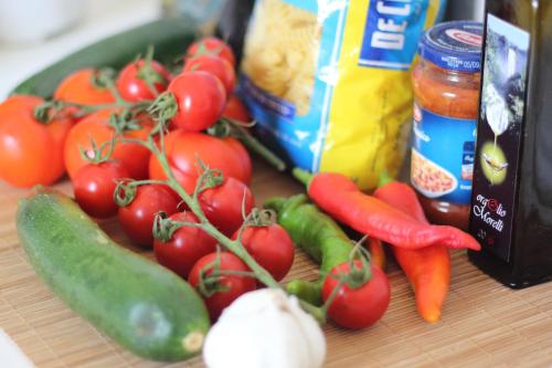 a bunch of tomatoes and other vegetables on a cutting board at Trullo Riccardo in Ostuni