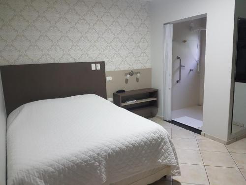 Ein Bett oder Betten in einem Zimmer der Unterkunft Hotel Nevada