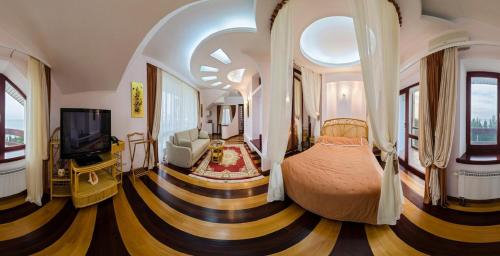 En eller flere senge i et værelse på Вязовая Роща Апарт-отель