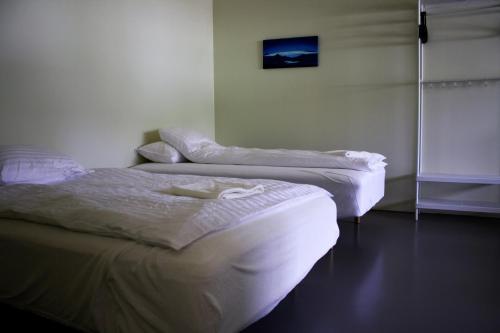 Postel nebo postele na pokoji v ubytování Kaldbakur Guesthouse