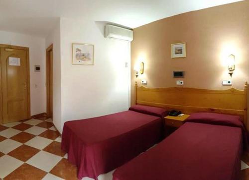 Voodi või voodid majutusasutuse Hotel Cabo de Mar toas