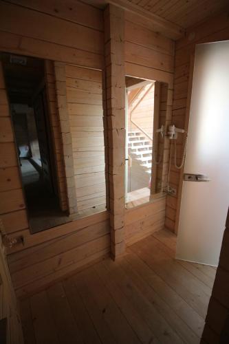an empty room with a door and a staircase at Villa Kaiser in Lviv