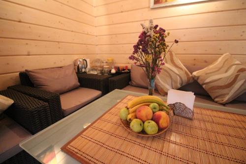 a bowl of fruit on a table in a room at Villa Kaiser in Lviv