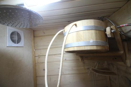 a barrel hanging from a wall in a room at Villa Kaiser in Lviv