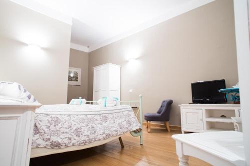 Телевизор и/или развлекательный центр в Le Erbe Guest House