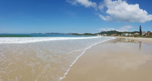 a view of the beach from the shore at Pousada Pedra da Gaivota in Bombinhas