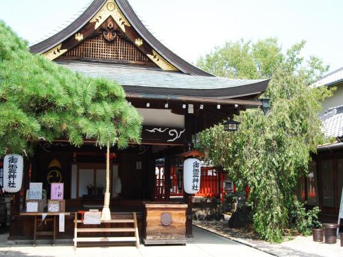 a building with a pagoda with benches in front of it at Hotel Wing International Select Osaka Umeda in Osaka