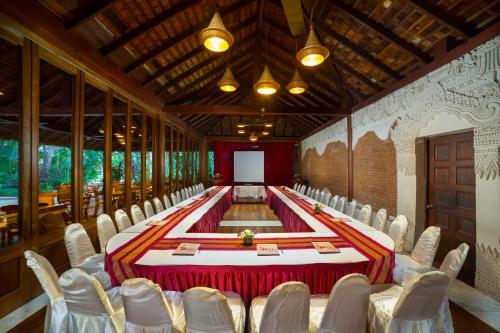 a conference room with a table and chairs at The Hotel @ Tharabar Gate in Bagan
