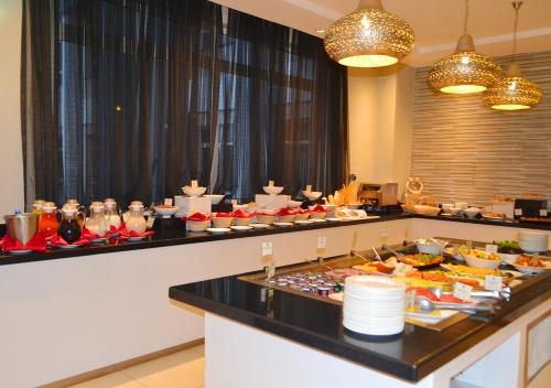 a buffet line with a lot of food on it at Eka Hotel Nairobi in Nairobi