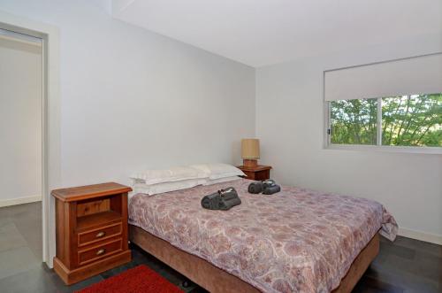 Ένα ή περισσότερα κρεβάτια σε δωμάτιο στο Treehouse Jervis Bay