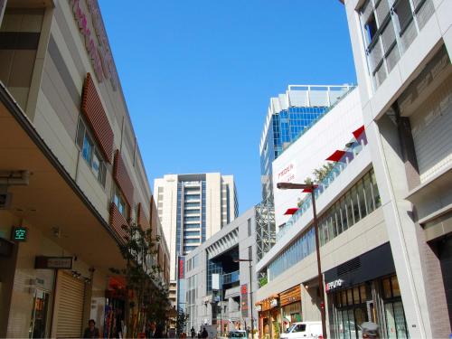 a street in a city with tall buildings at Hotel Wing International Select Osaka Umeda in Osaka