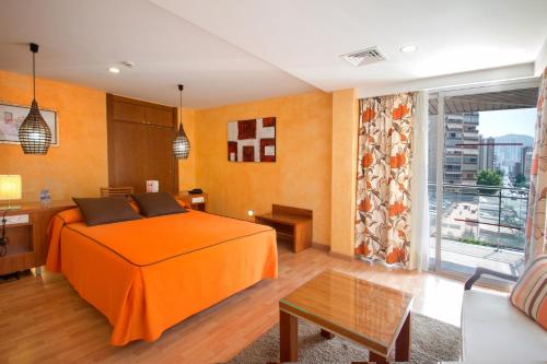 En eller flere senge i et værelse på Hotel Servigroup Diplomatic