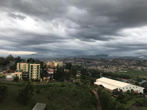 an overhead view of a city under a cloudy sky at Dmall Hotel in Kigali