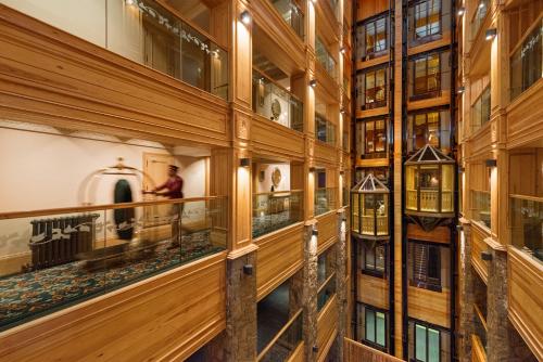 a hallway of a building with wooden walls and windows at Michlifen Resort & Golf in Ifrane