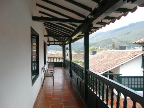 a balcony with a view of the mountains at Hotel Hospederia San Carlos Villa De Leyva in Villa de Leyva