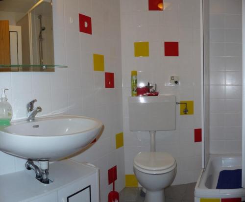 a bathroom with a sink and a toilet at "Haus Saskia" in Wutha-Farnroda