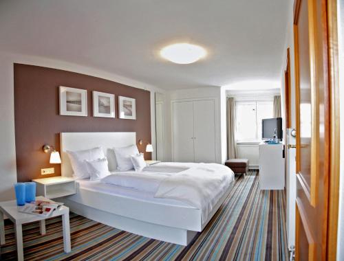 Llit o llits en una habitació de Hotel Guter Tropfen
