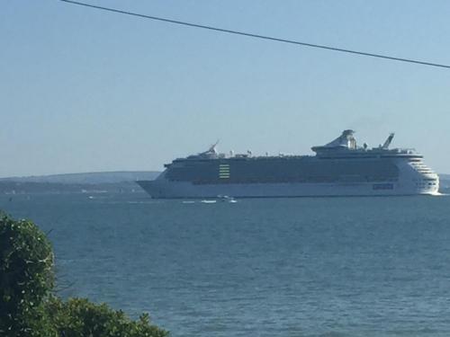 a large cruise ship is in the water at Cove Cott Guest Accommodation in Warsash