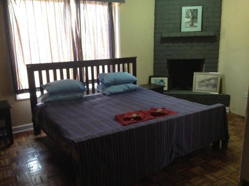 a bedroom with a bed with two plates on it at Teule Guest House in Oloitokitok 