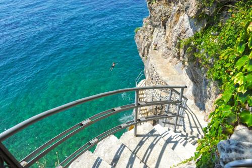 a view of the ocean from a cliff at Villa Pietra Santa in Positano