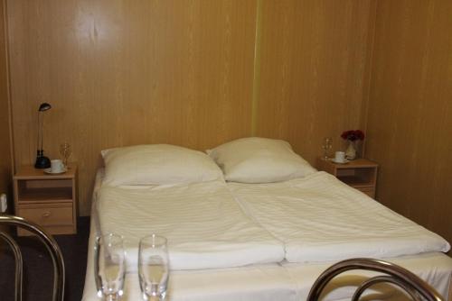 a hotel room with two beds and a table at BeachCamp Nová Role in Nová Role