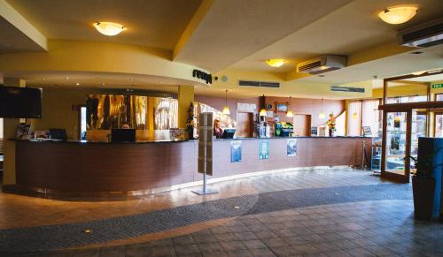 a lobby with a bar in a restaurant at Chata 107 Tatralandia Village in Liptovský Mikuláš