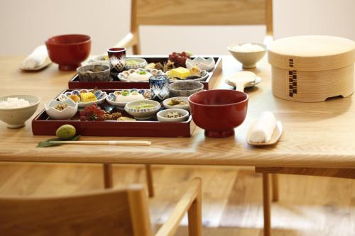 a table with a tray of food on a table at Yamagata The Takinami in Nanyo