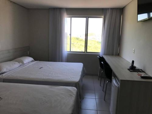 Postel nebo postele na pokoji v ubytování COBH Hotel